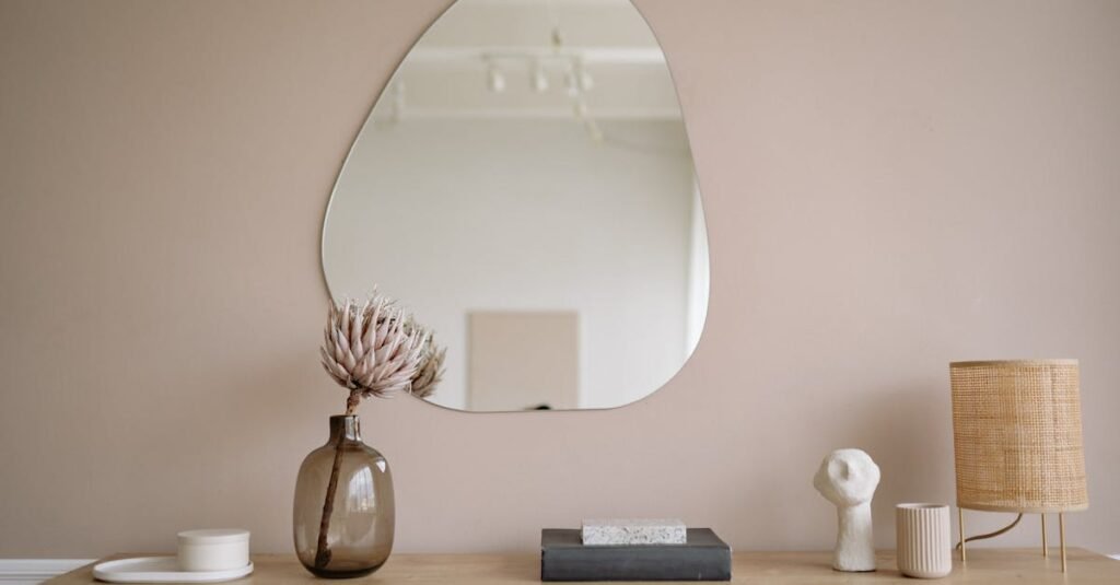 Stylish minimalist interior featuring a mirror, decorative vase, and lamp.